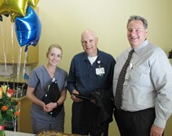Salida hospital CEO Bob Morasko congratulates Ron Bobo, TRAC STAR of the first quarter, and finalist Kayla Jimerson at a hospital ceremony on April 25