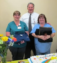 HRRMC CEO Bob Morasko congratulates TRAC STAR finalist Marcie Contreras (L) and winner Dee-Ann Troutman at a hospital ceremony